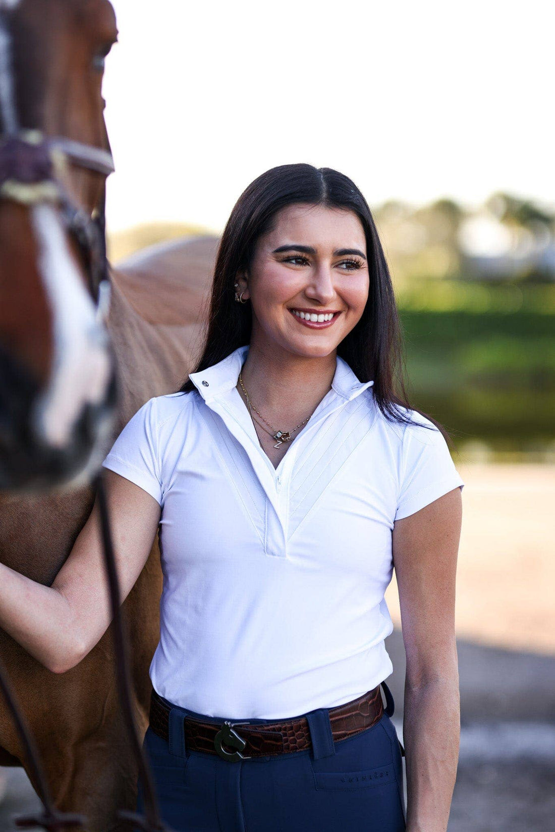 White | Margot Show Shirt, show shirt on model beside a bay horse