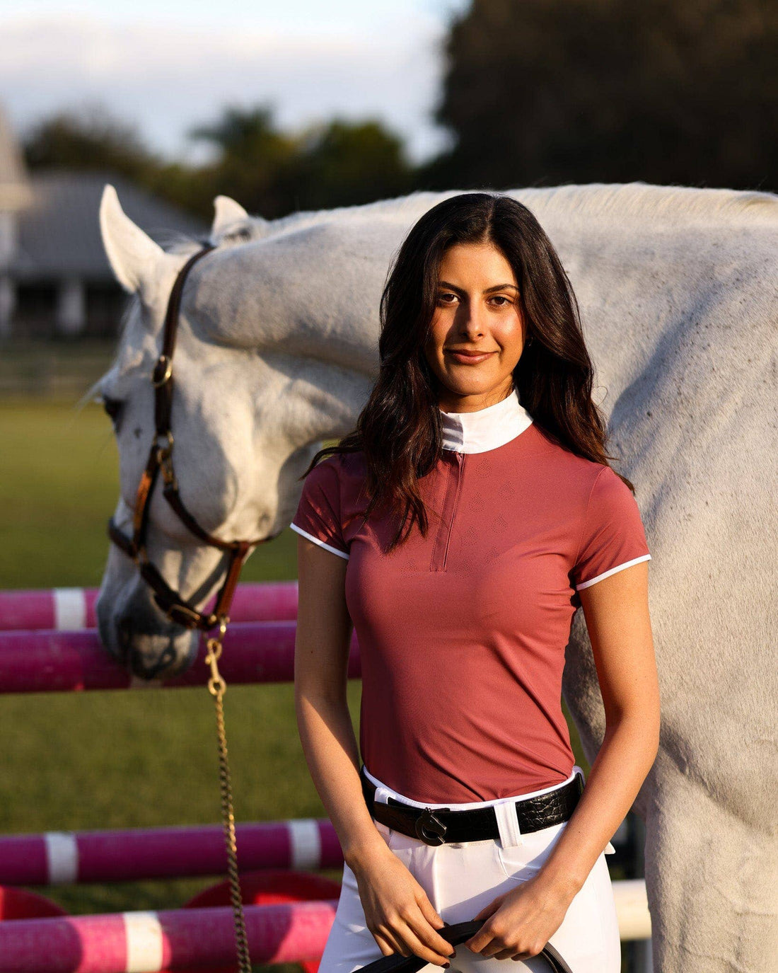 Cherry | Bella Short Sleeve Show Shirt, on model standing with a grey horse