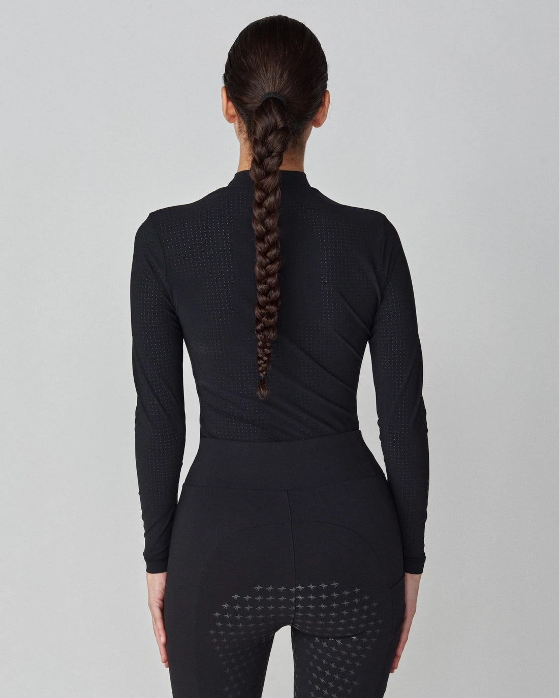 Black | AirTech Long Sleeve, back view on model with braided hair