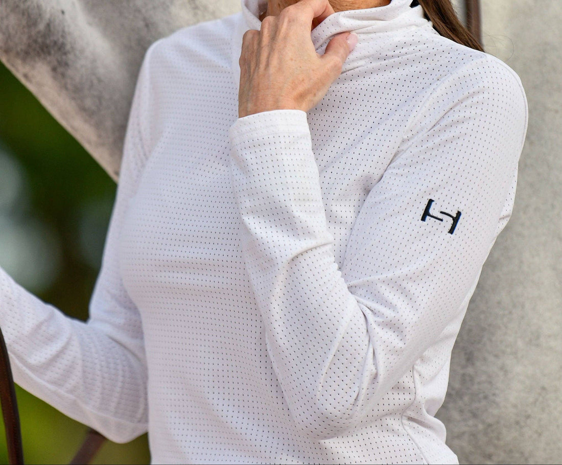 White | Elevated Standard Performance™ Micro Mesh Top, close-up of the mesh fabric and logo on the sleeve