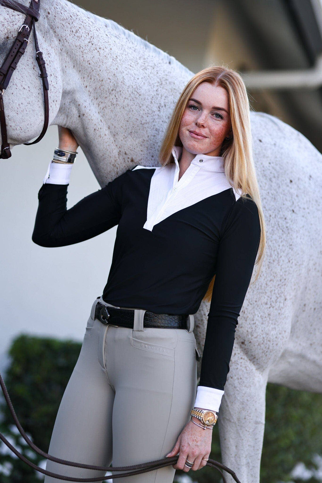 Black | Amelie Show Shirt, on model with a horse, white contrast bib front